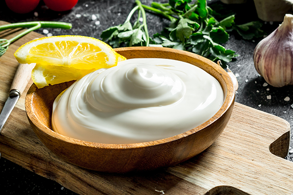 Homemade mayo in wooden bowl