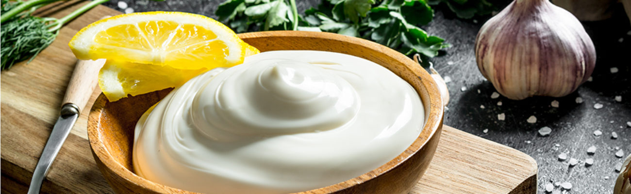 Homemade mayo in wooden bowl