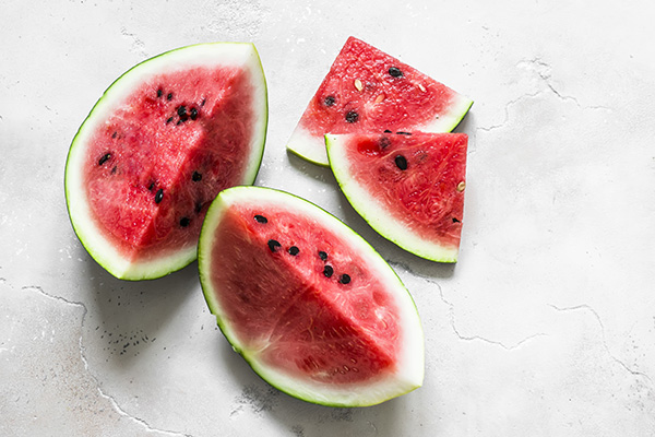Fresh ripe watermelon on a light background.