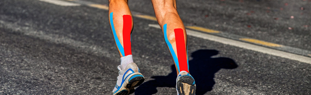 Cropped shot of runner's legs with KT Tape