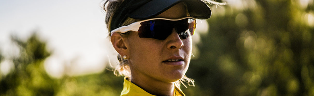 Female runner wearing wraparound sunglasses