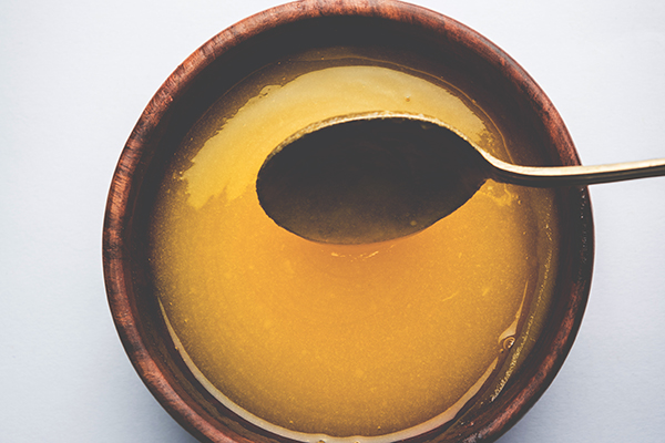 Ghee in wooden bowl