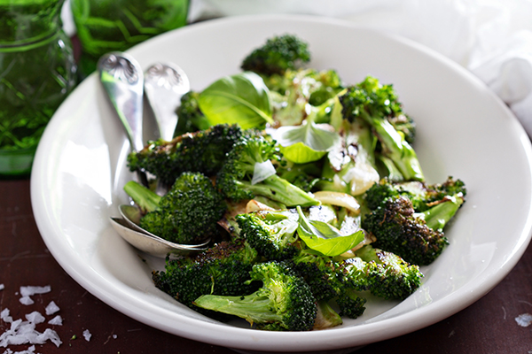 Roasted broccoli with crispy garlic on plate