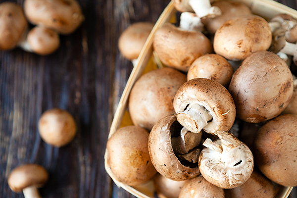 Raw mushrooms in a basket