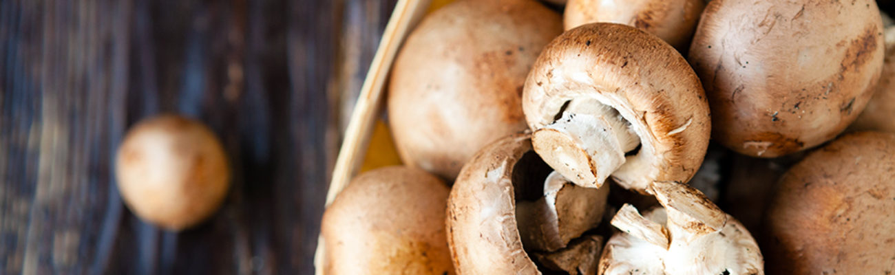 Raw mushrooms in a basket