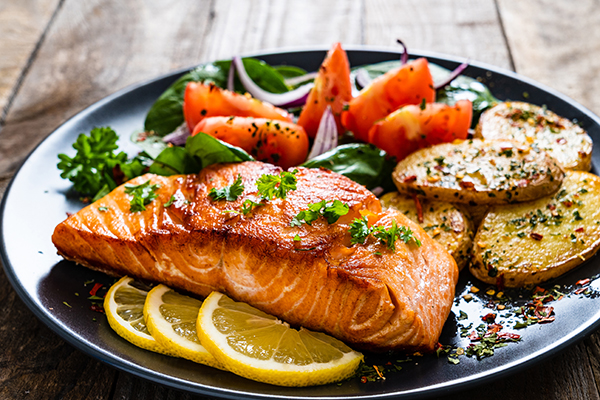 Grilled salmon and vegetables on a plate