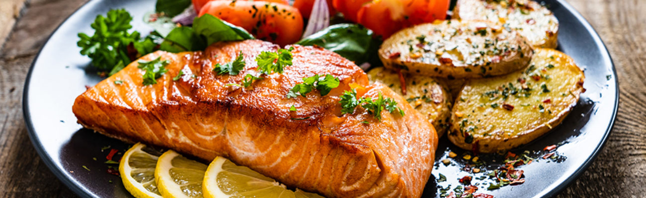 Grilled salmon and vegetables on a plate