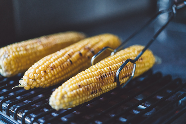 Grilling the corn on a barbecue grill.