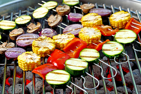 Mixed vegetable skewers on a hot barbecue