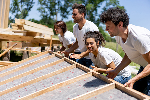 Volunteers helping build a house