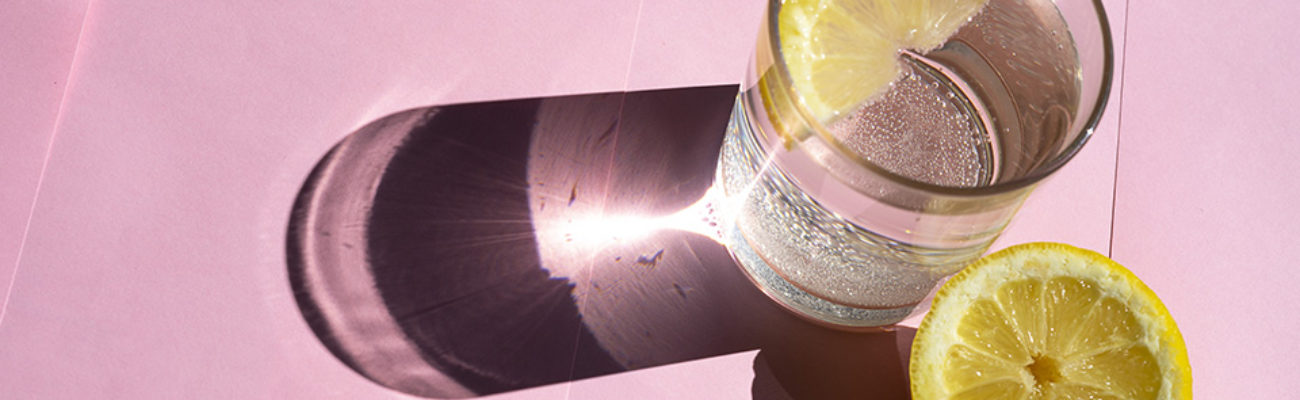 Glass of seltzer water with lemon