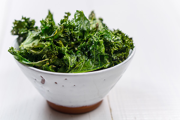 Kale chips in white bowl