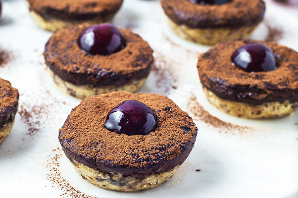 Mini Chocolate Cherry Cheesecake Bites on a plate