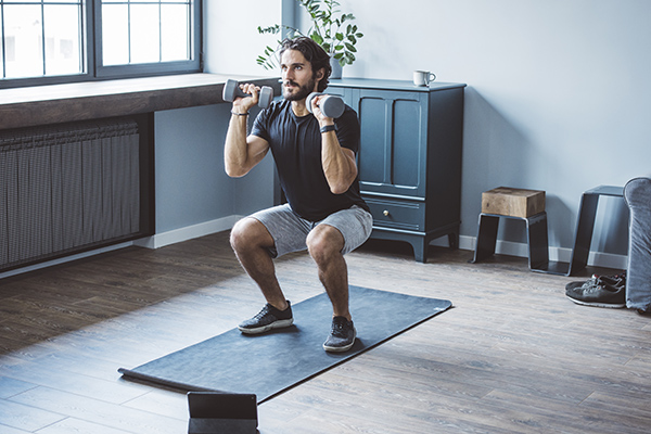 Man doing full-body workout at home