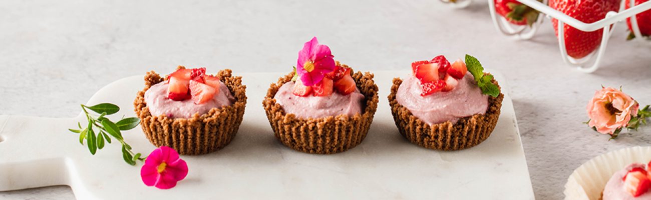 Mini Strawberry Cheesecakes on marble cutting board