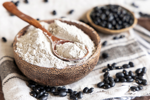 Bowl with black beans flour