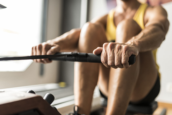 Close up of man on rowing machine