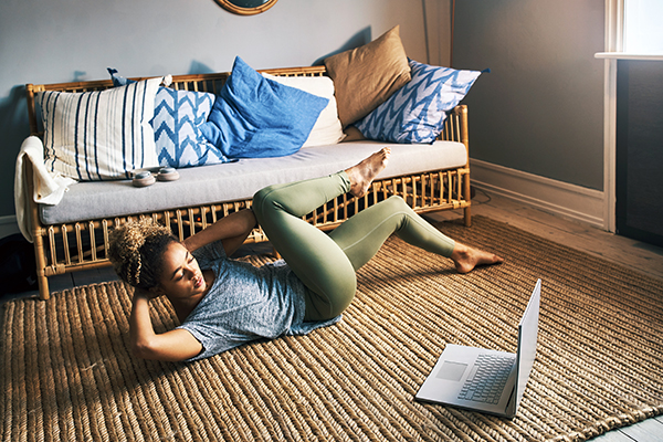 Woman doing bicycle crunches at home