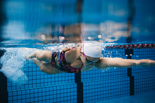 Underwater shot of woman swimming laps