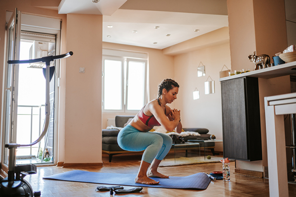 woman doing home workout | 30 day fitness challenges