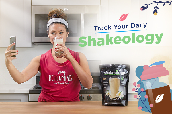 Woman taking selfie drinking Shakeology