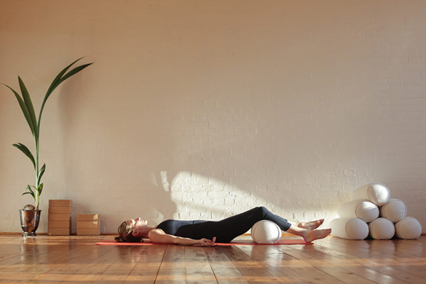 Woman practicing yoga at home
