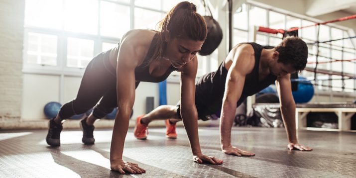 Muscular woman doing stretching workout in gym – Jacob Lund Photography  Store- premium stock photo