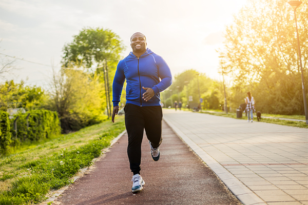 happy man running | benefits of running