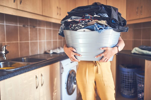 Woman holding laundry basket