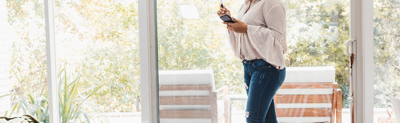 Woman pacing at home on phone