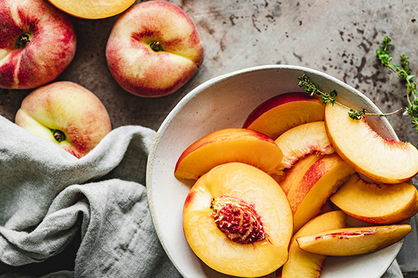 Peach slices in a bowl