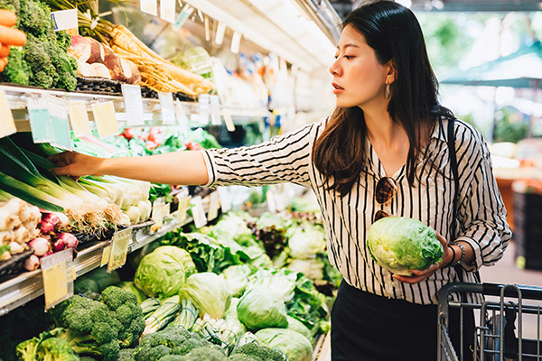 Woman shopping for vegetables