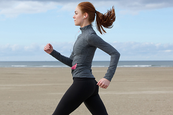 Side view of woman walking on beach