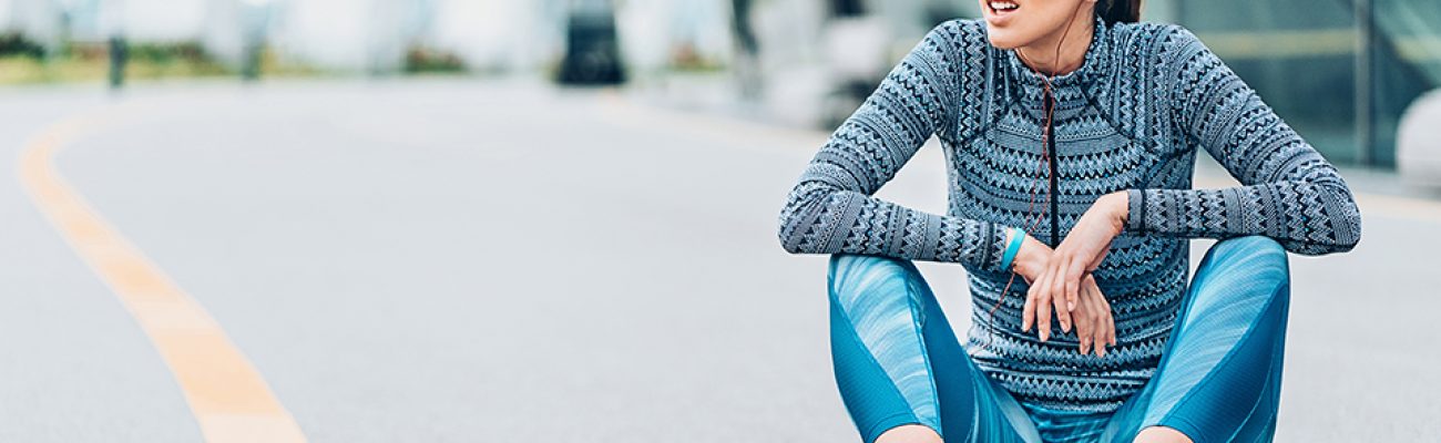 Woman sitting on ground after bad workout