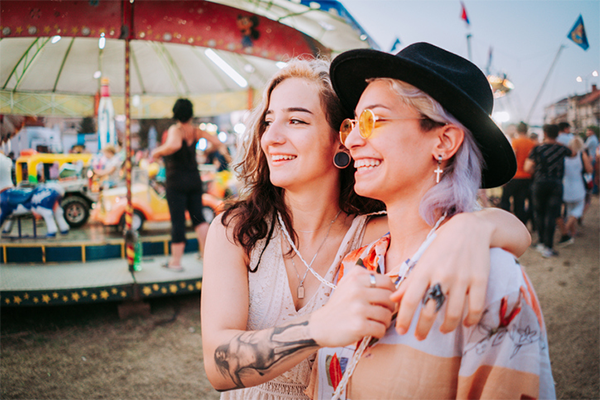 couple walking at amusement park | active date ideas