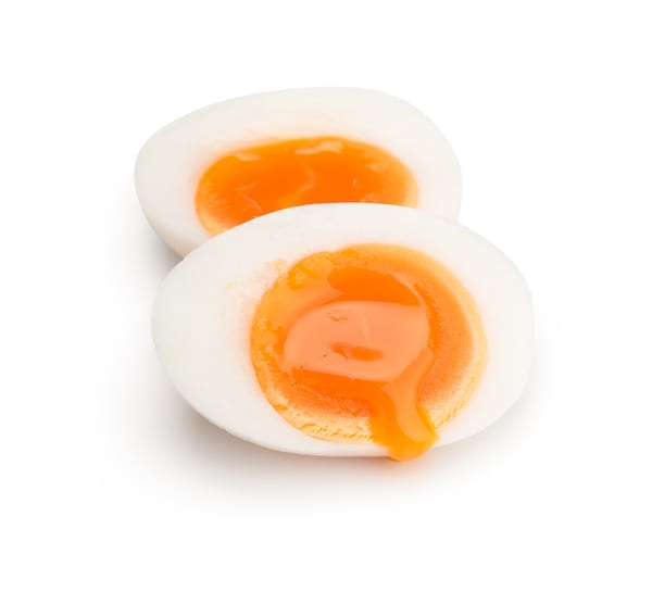 sliced in half hard boiled egg calories yolks