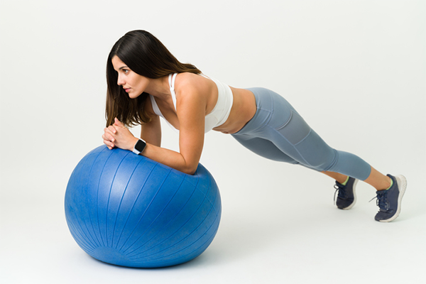 woman doing stability ball plank | Stability Ball Rollout