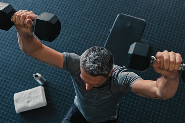 Man lifting dumbbells