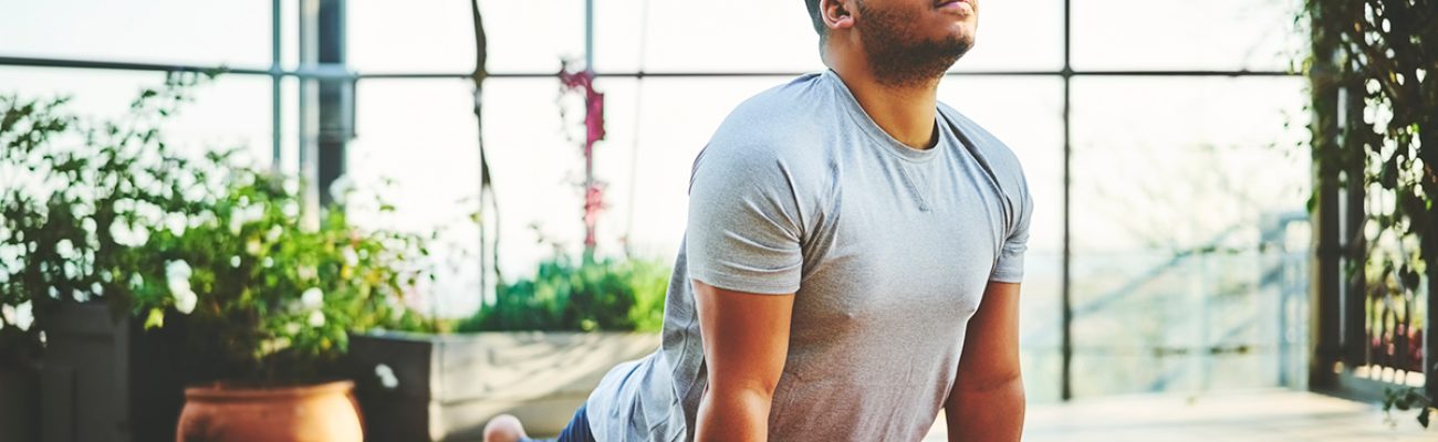 man doing yoga | wellness routine