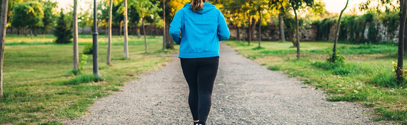 Woman walking outside on path