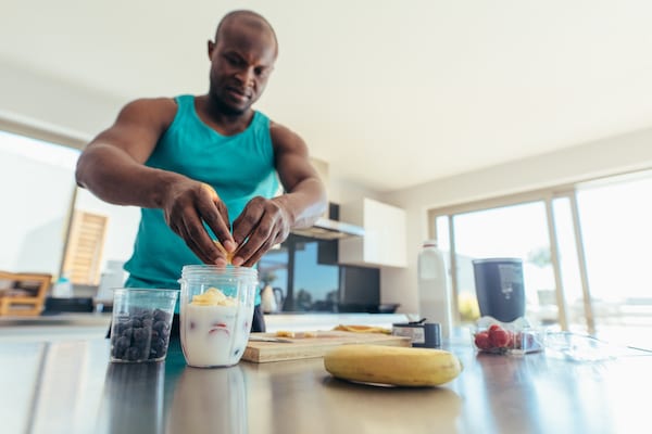 man making protein shake for breakfast