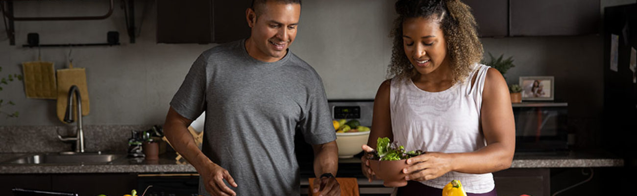 Couple making healthy meal in kitchen