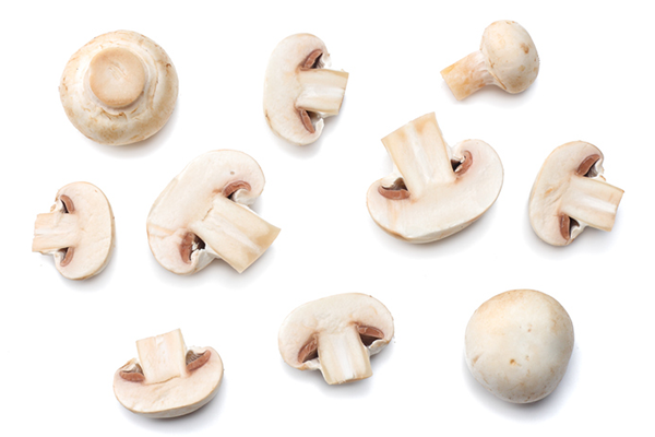 chopped mushrooms on white background | best frozen veggies