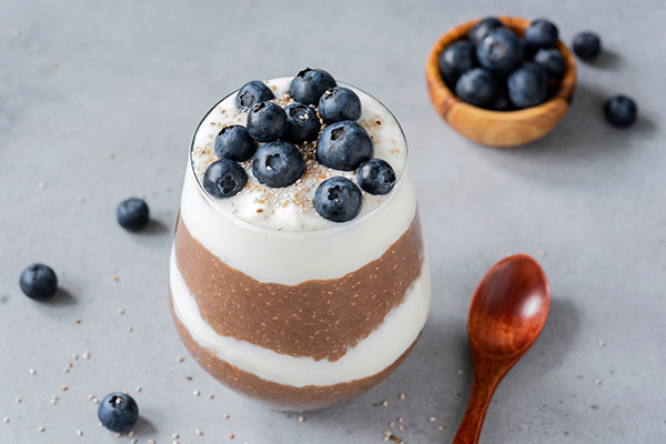 Chia pudding parfait with yogurt, blueberries and chocolate