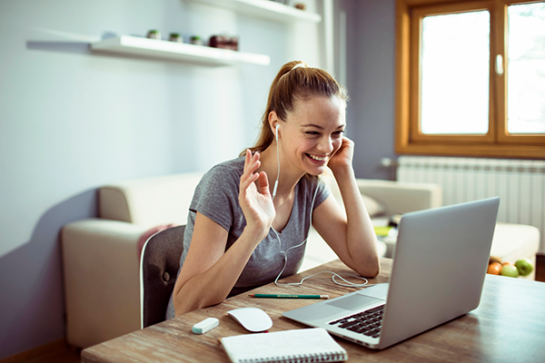 smiling woman on video call | holiday stress tips