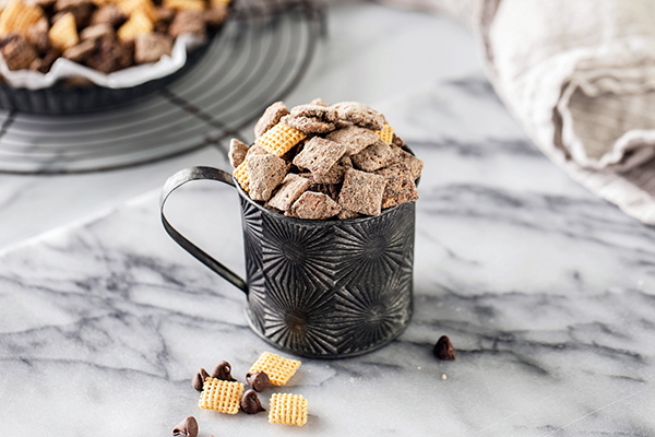Cookies & Creamy Muddy Buddies in a tin cup