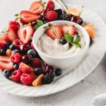 Cookies & Creamy Fruit Dip in a bowl on a plate of fruit