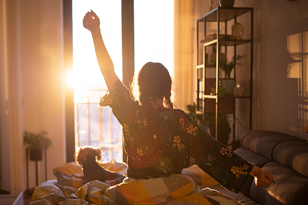 woman waking to morning light | health esteem