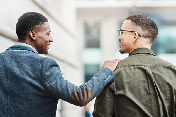 encouraging man with hand on other man's shoulder | health esteem