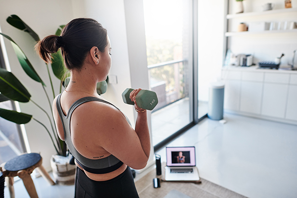 Woman lifting weights at home